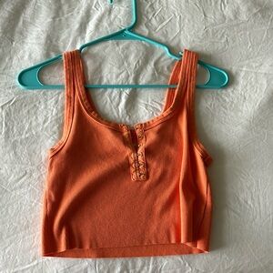 Orange aerie tank with clasps in the front